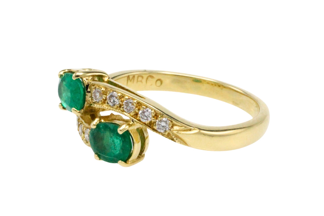 Vintage emerald and diamond crossover ring