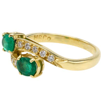 Vintage emerald and diamond crossover ring