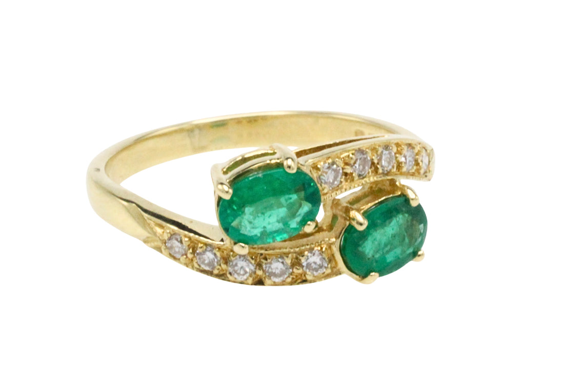 Vintage emerald and diamond crossover ring