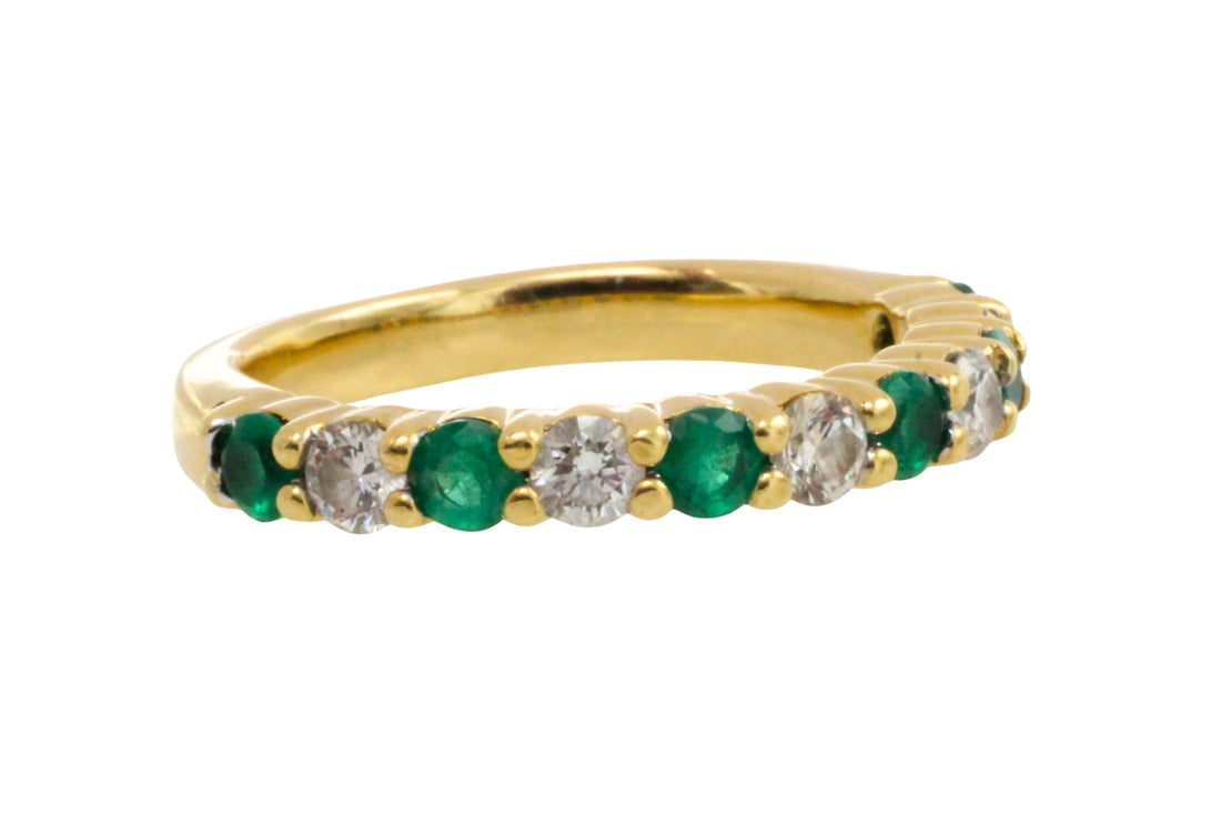 Emerald and diamond band in 18 carat gold