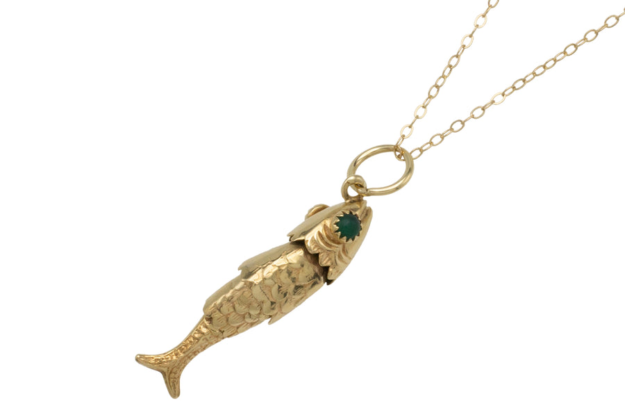 Vintage 14 carat gold fish pendant with chrysoprase eyes