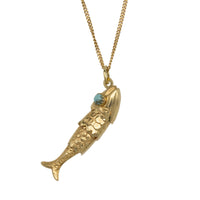 Vintage 14 carat gold fish pendant with turquoise eyes