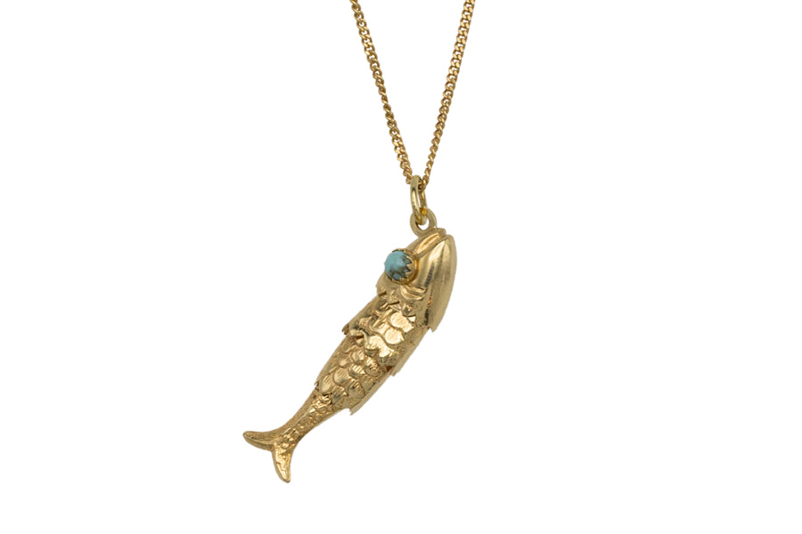 Vintage 14 carat gold fish pendant with turquoise eyes