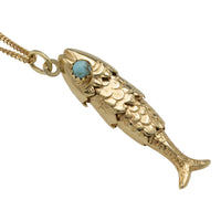 Vintage 14 carat gold fish pendant with turquoise eyes