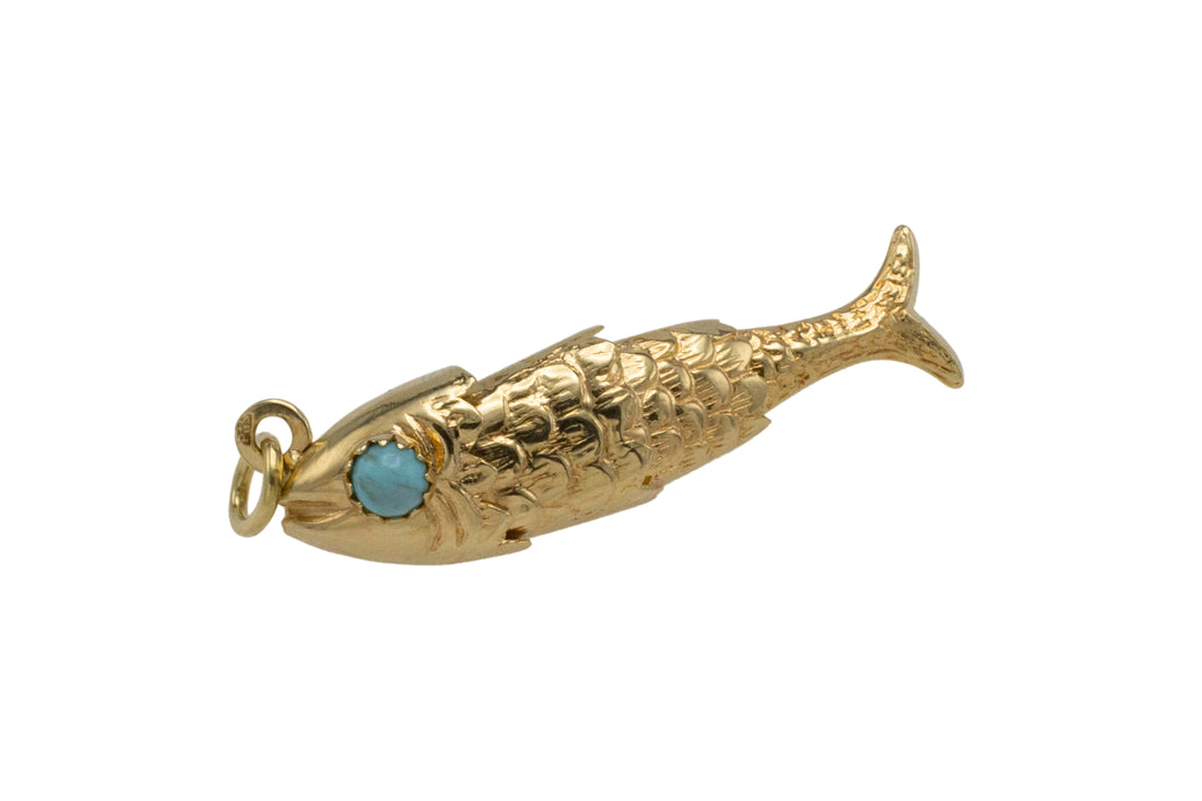 Vintage 14 carat gold fish pendant with turquoise eyes