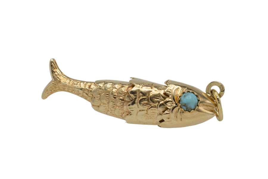 Vintage 14 carat gold fish pendant with turquoise eyes