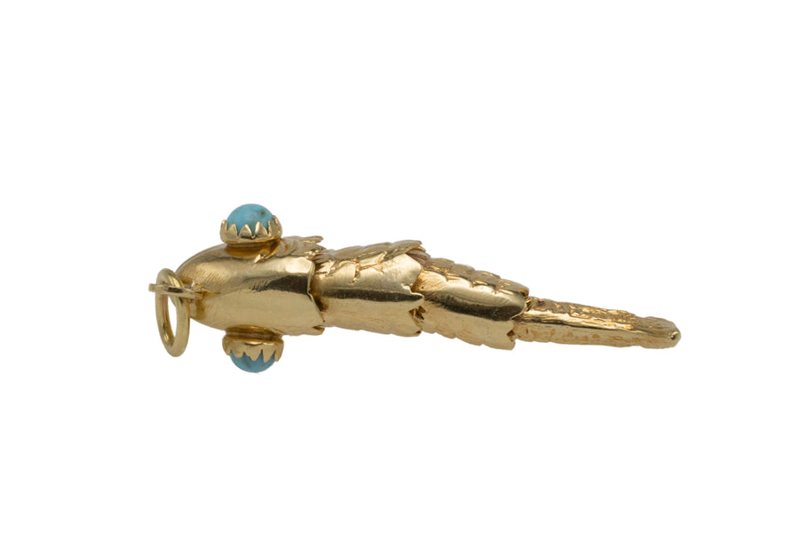 Vintage 14 carat gold fish pendant with turquoise eyes