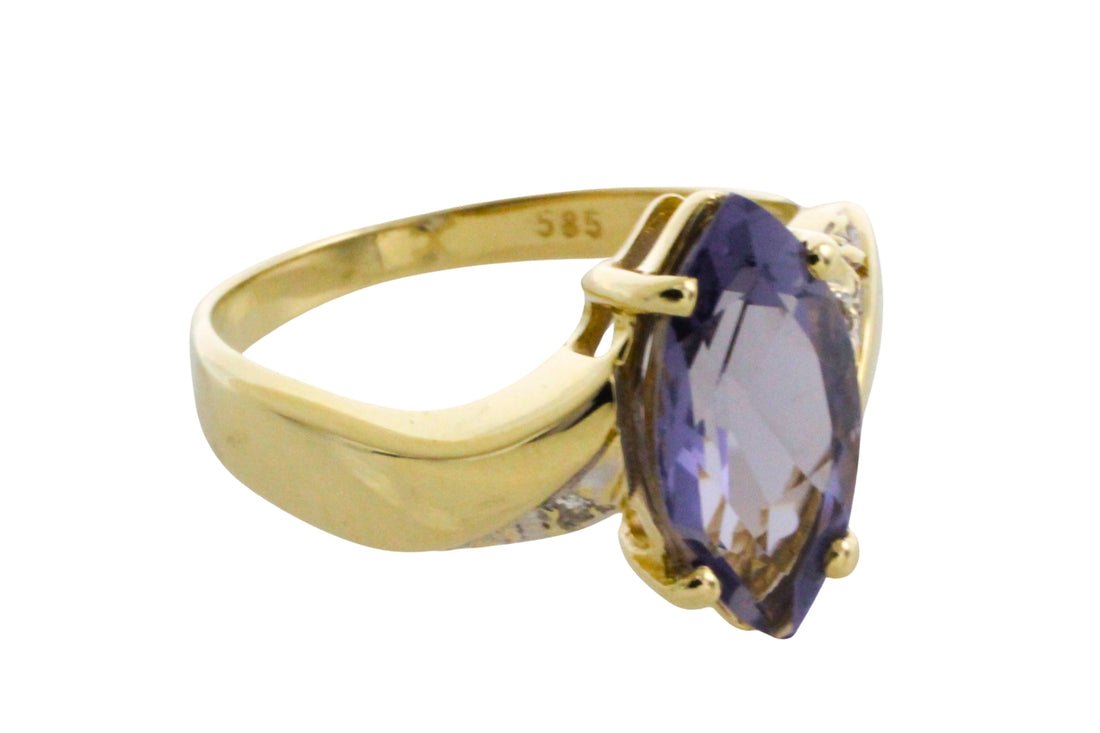 Iolite and diamond ring in 14 carat gold
