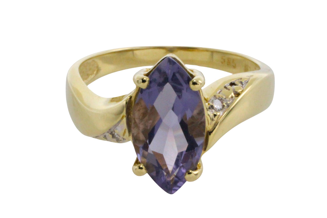 Iolite and diamond ring in 14 carat gold