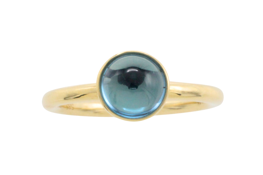 Cabochon blue topaz ring in 14 carat gold