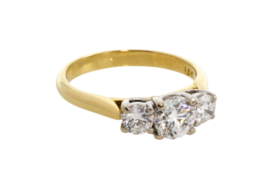 Three stone brilliant cut diamond ring