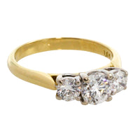 Three stone brilliant cut diamond ring