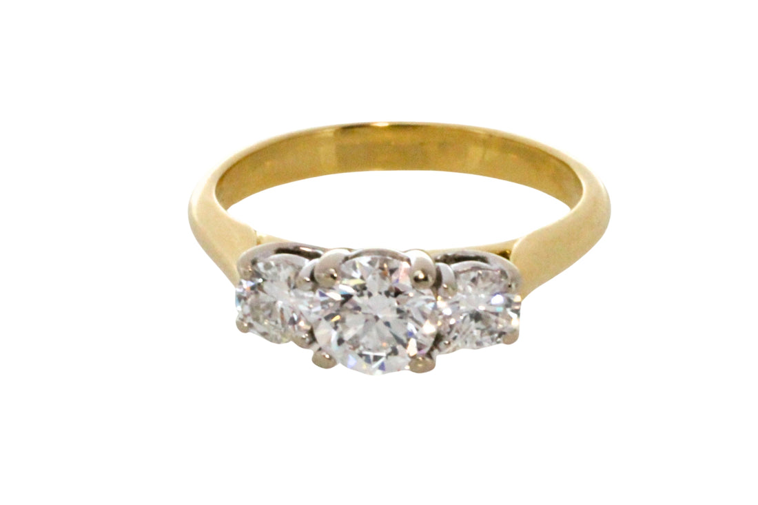 Three stone brilliant cut diamond ring