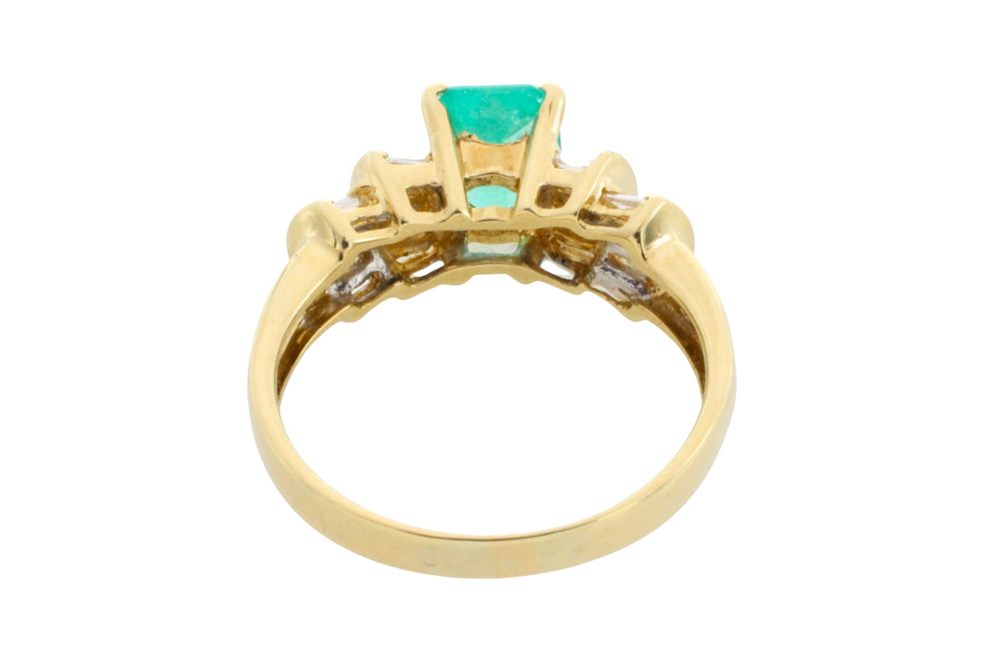 Emerald and baguette cut diamond ring in 18 carat gold
