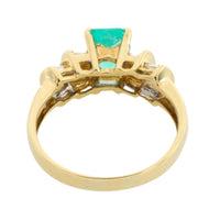 Emerald and baguette cut diamond ring in 18 carat gold