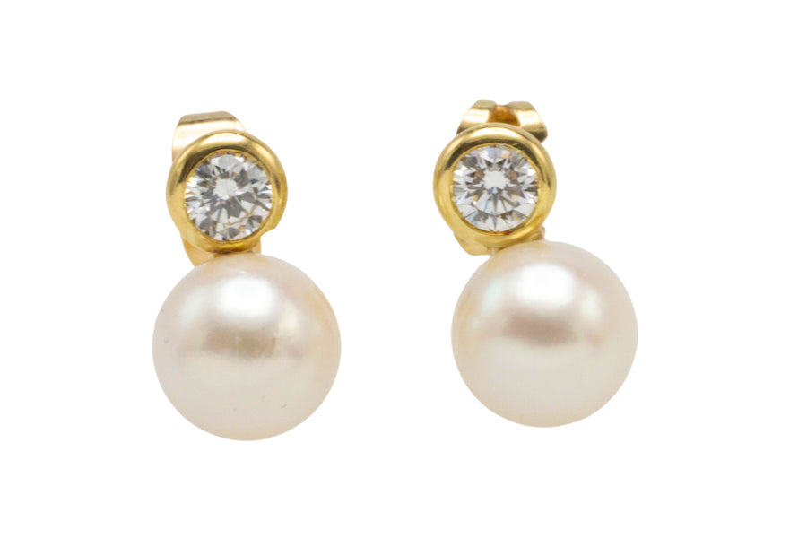 14 carat gold pearl and diamond studs