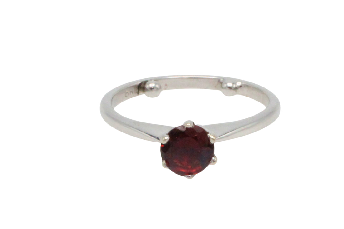 Garnet solitaire ring in white gold