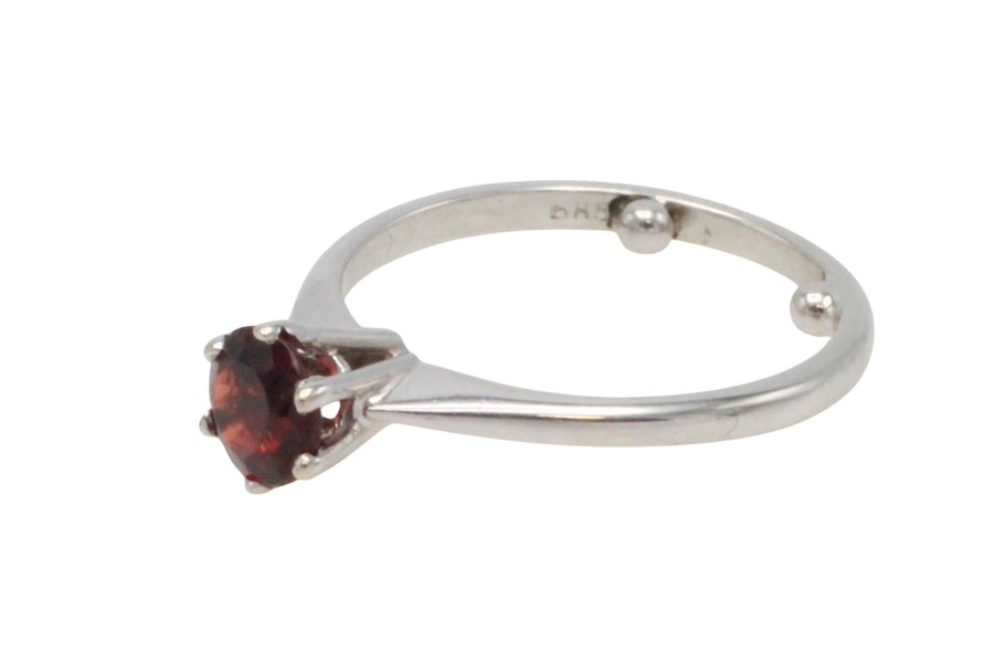 Garnet solitaire ring in white gold