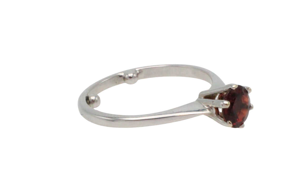 Garnet solitaire ring in white gold