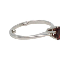 Garnet solitaire ring in white gold