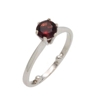 Garnet solitaire ring in white gold