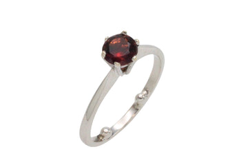 Garnet solitaire ring in white gold