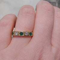 18 carat gold band with emeralds and diamonds