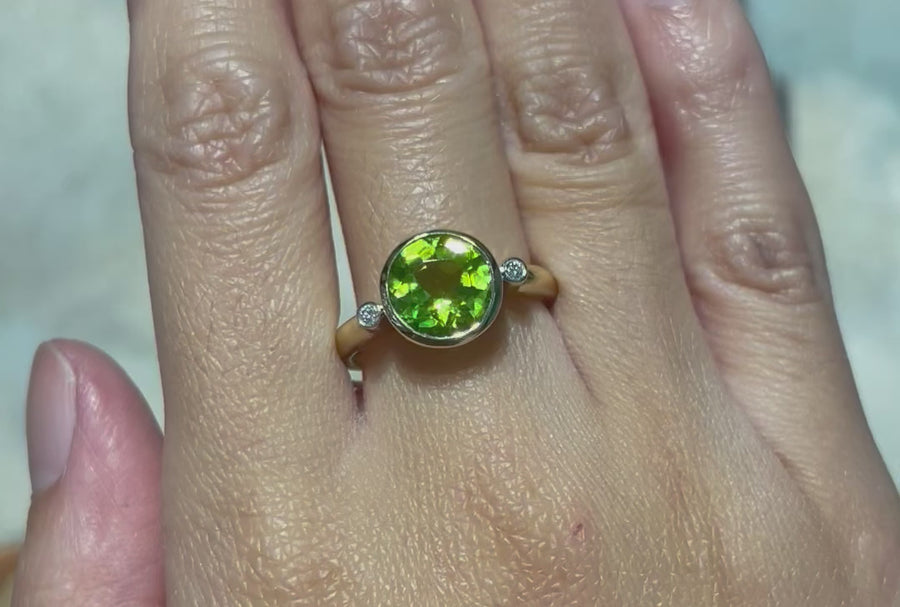 Peridot and diamond ring in 14 carat gold