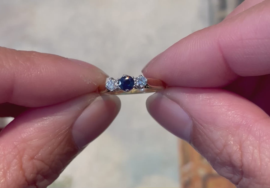 Three stone sapphire and diamond ring in 18 carat gold