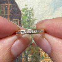 18 carat gold ring channel set with diamonds