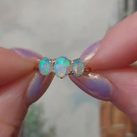 Three stone opal ring in 18 carat gold