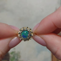 Opal doublet and sapphire cluster ring