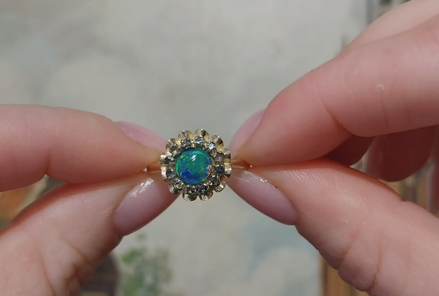 Opal doublet and sapphire cluster ring