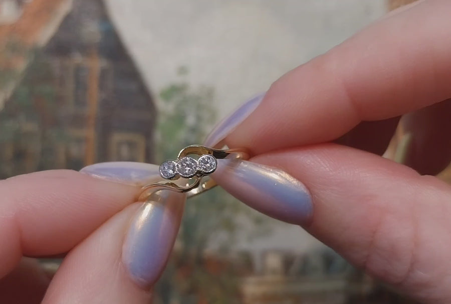 Vintage 18 carat gold swirl ring with diamonds