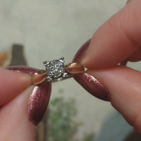 14 carat gold solitaire style ring with diamonds