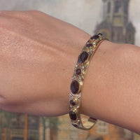 Garnet hinged bracelet in 14 carat gold