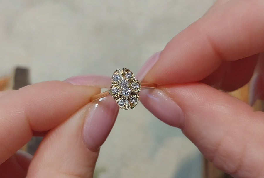 Oval diamond cluster ring in 14 carat gold