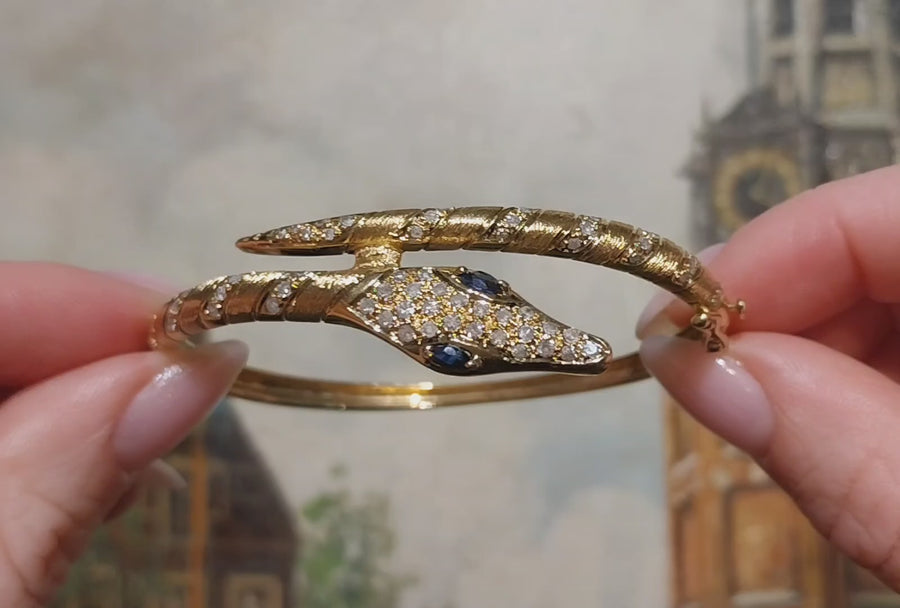 18 carat snake bracelet with diamonds and sapphires