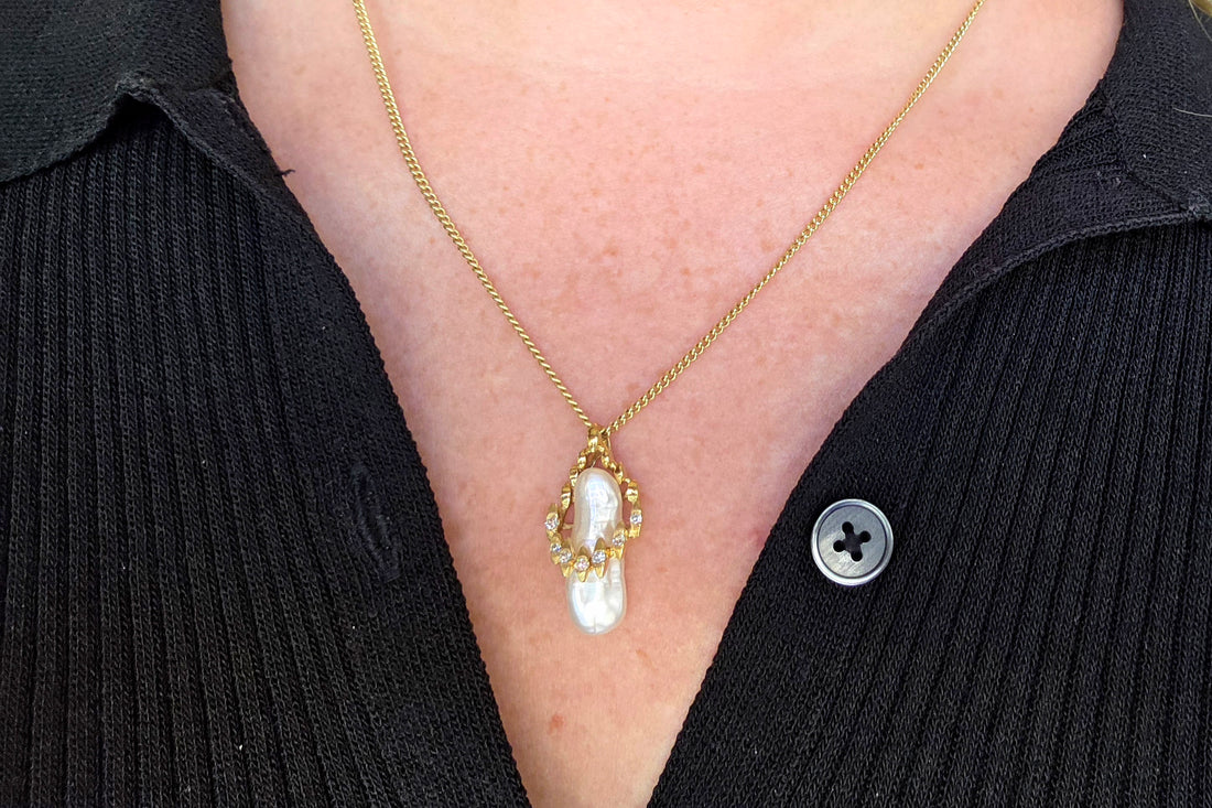 Baroque pearl and diamond pendant in 14 carat gold