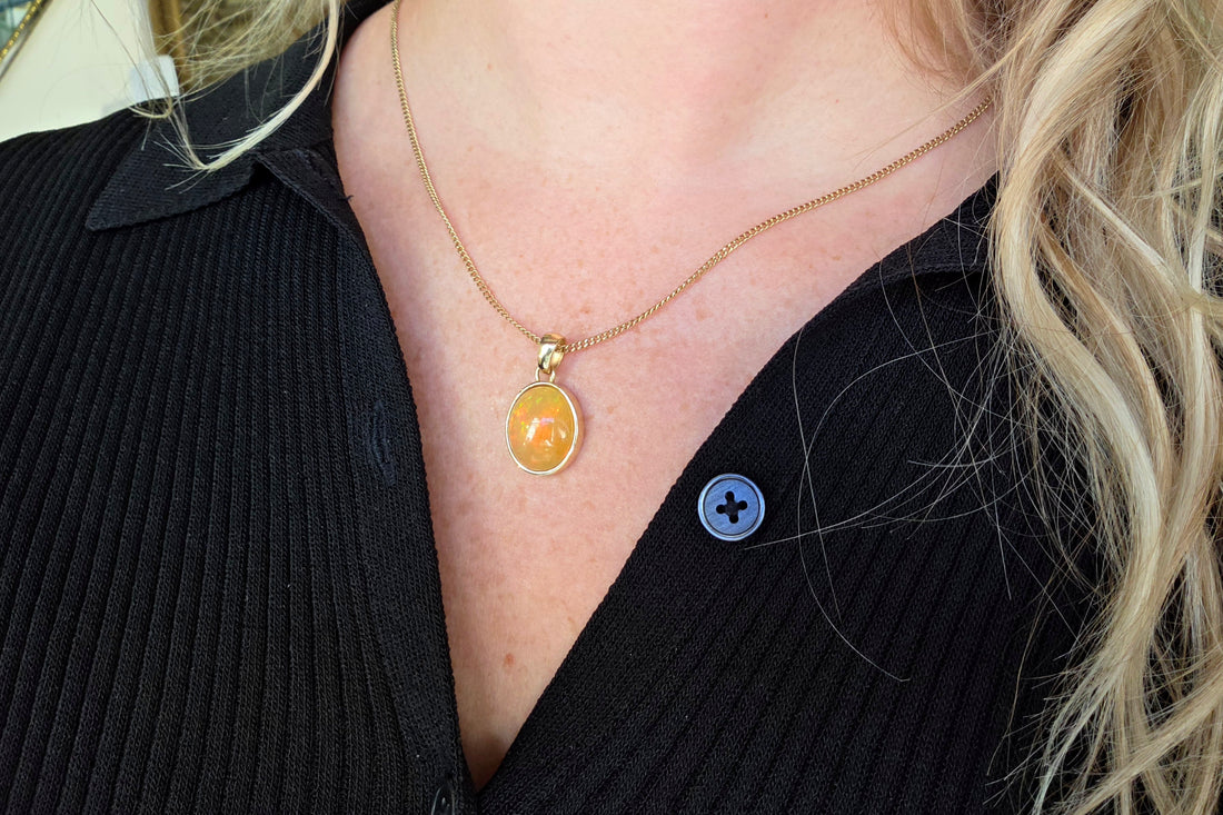 Orange opal pendant in 14 carat gold
