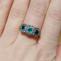 Vintage emerald and diamond triple cluster ring