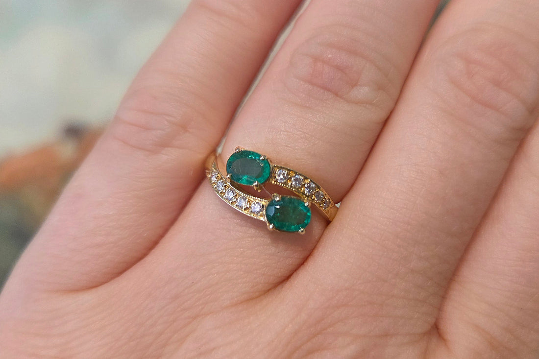 Vintage emerald and diamond crossover ring