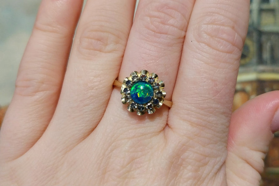 Opal doublet and sapphire cluster ring