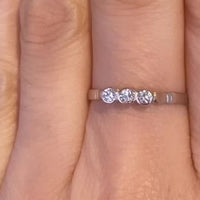 Three stone diamond ring in 14 carat gold.