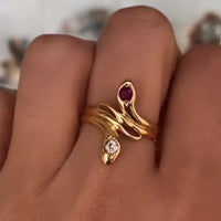 Ruby and diamond snake ring in 18 carat gold.